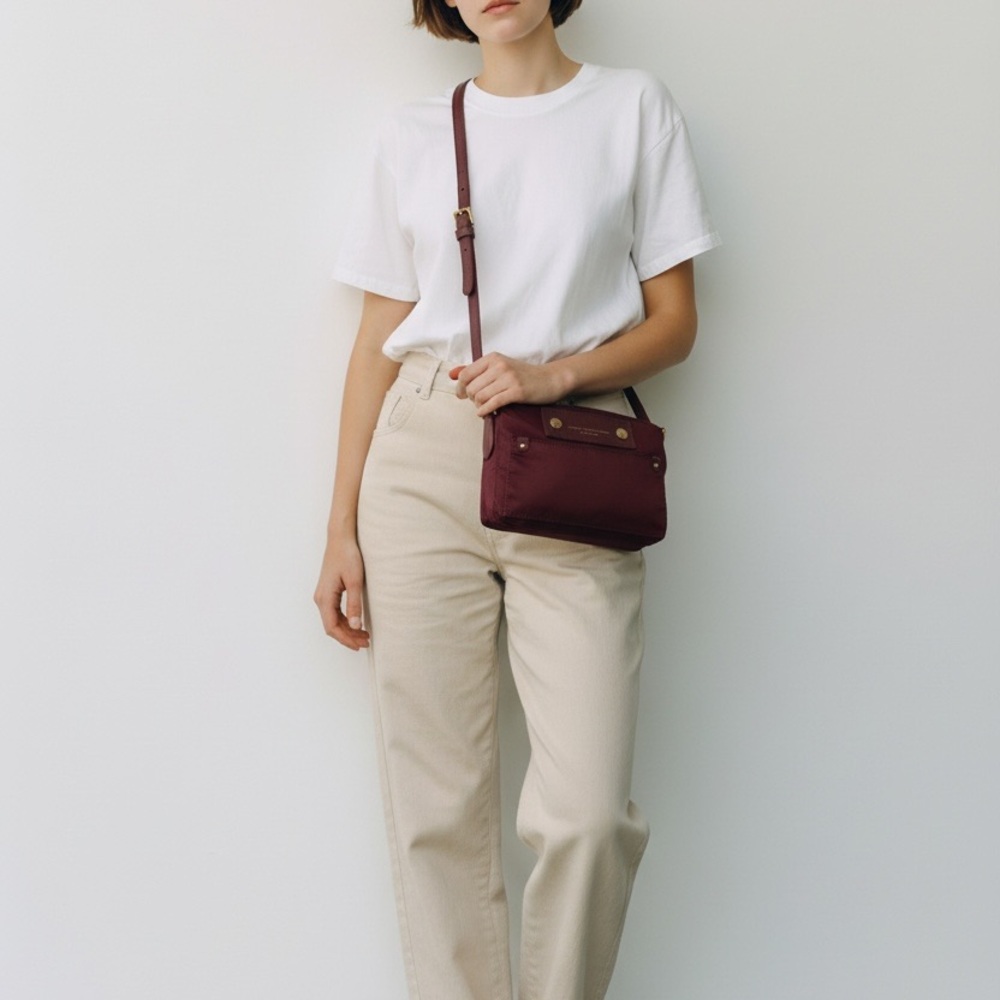 Marc by Marc Jacobs Preppy Nylon Mini Natasha Crossbody Bag in a burgundy